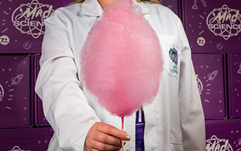 Mad Scientist holding cotton candy.